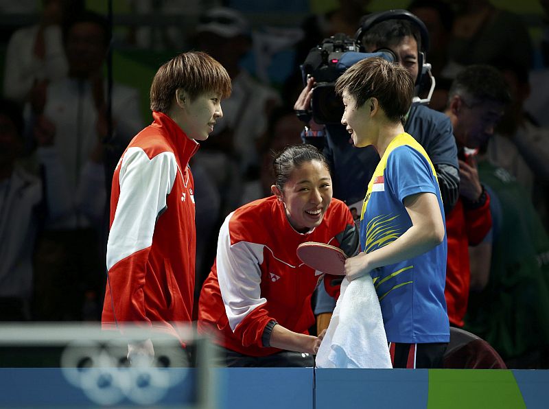Zhou Yihan, Yu Mengyu and Feng Tianwei of Singapore celebrate their win over South Korea at Riocentro, Rio de Janeiro, August 14. 2016. u00e2u20acu201d Reuters pic