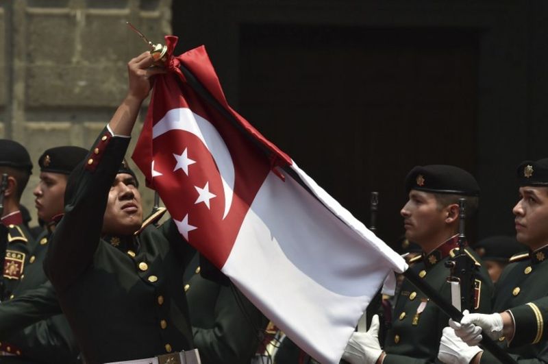 The Singaporean flag in Mexico City. u00e2u20acu201d AFP picn