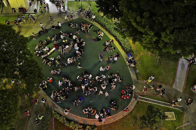 'Pokemon Go' players at Block 401, Hougang Avenue 10, yesterday. Due to the gameu00e2u20acu2122s popularity, some commercial buildings have had to manage a surge of visitors. u00e2u20acu201d TODAY pic