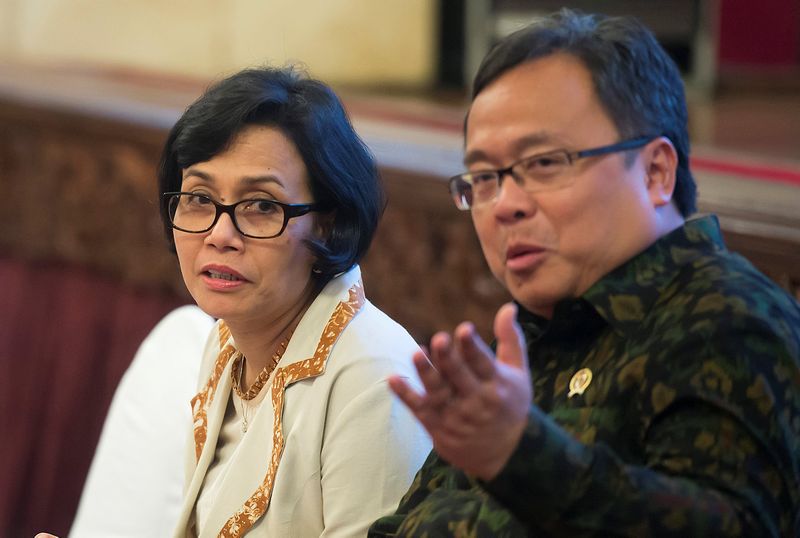 Indonesian Finance Minister Sri Mulyani Indrawati (left) talks with the chief of Ministry of National Development Planning Bambang Brodjonegoro before a meeting about tax amnesty in Jakarta July 28, 2016. u00e2u20acu201d Reuters pic