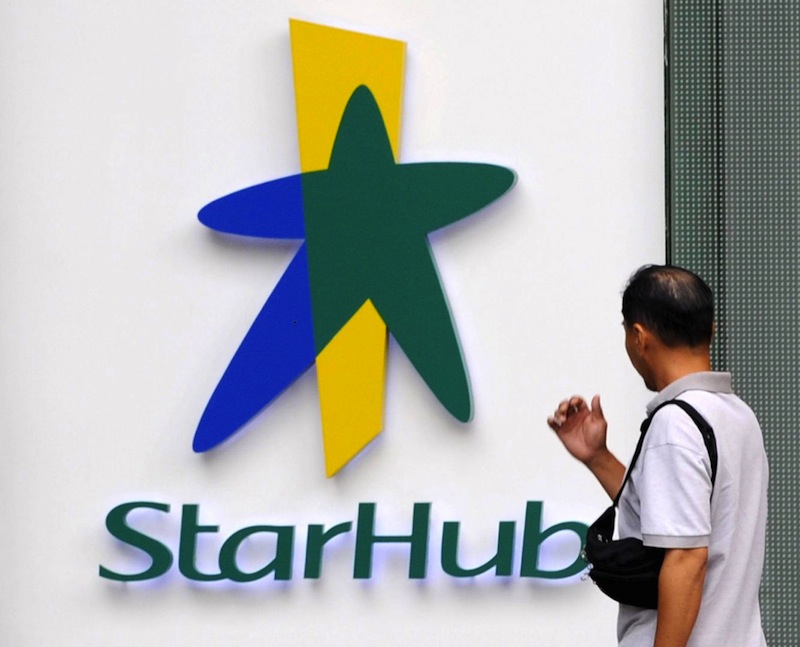 A man walks past the Starhub logo sign in Singapore in the file photo. u00e2u20acu201du00c2u00a0AFP pic