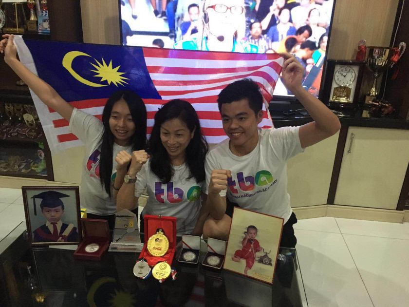 From left) Wee Kiongu00e2u20acu2122s sister Yun Ying, mother Tan Yok Hua and brother Wee Tat have parked themselves in front of the TV in their Tawau, Sabah home to watch the Olympic men's doubles final match ongoing now. u00e2u20acu2022 Picture courtesy of Tan Wee Tat