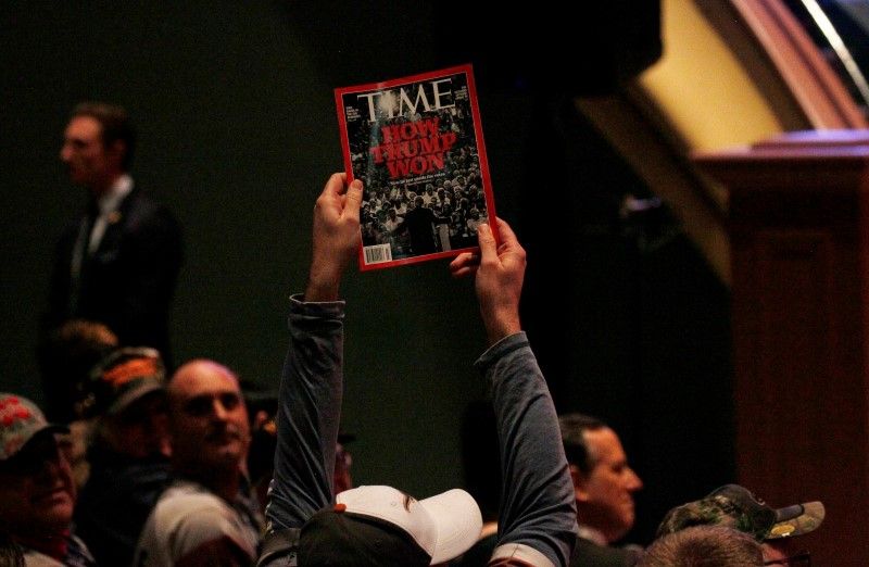 A supporter holds up a copy of Time Magazine with the cover headline u00e2u20acu02dcHow Trump Wonu00e2u20acu2122 during Trumpu00e2u20acu2122s speech at a veteranu00e2u20acu2122s rally in Des Moines, Iowa in this picture released August 5, 2016. u00e2u20acu201d Reuters pic