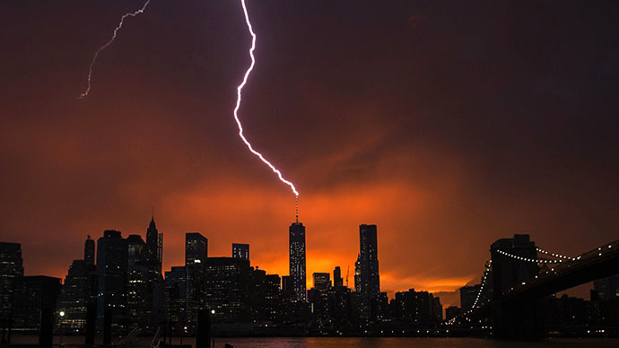 Lightning strikes One World Trade Center in Manhattan as the sun sets behind the city after a summer storm in New York July 2, 2014. Reuters / Lucas Jackson