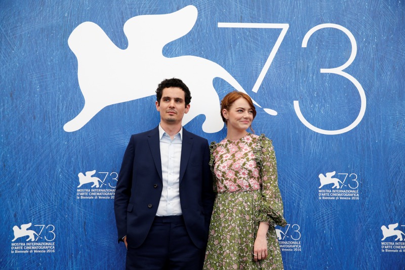 Director Damien Chazelle (left) and actress Emma Stone (right) attend the photocall for the movie u00e2u20acu02dcLa La Landu00e2u20acu2122 at the 73rd Venice Film Festival in Venice, Italy, August 31, 2016. u00e2u20acu201d Reuters pic