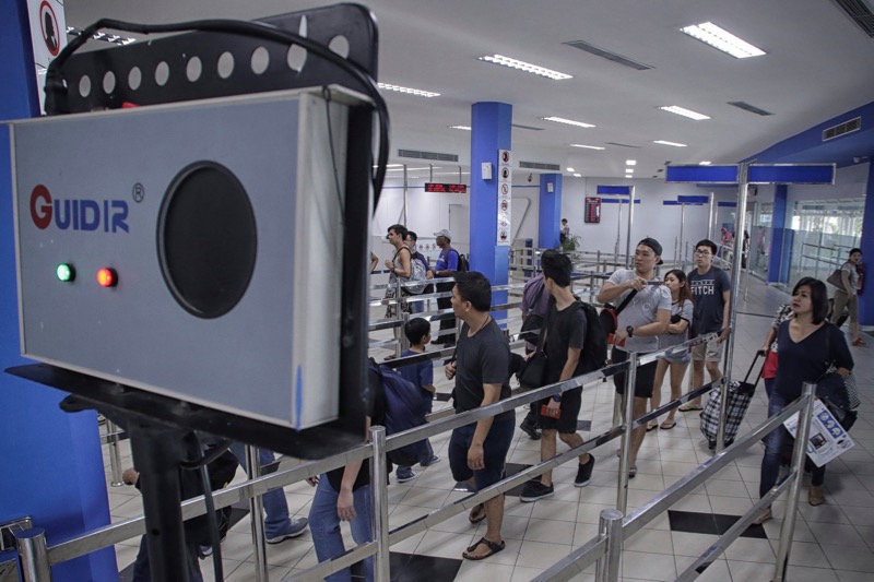 Passengers from a ferry from Singapore pass by an infrared scanner before passport control at the international ferry terminal in Batam, Riau Islands, Indonesia on August 31, 2016, in this photo taken by Antara Foto. u00e2u20acu201d Antara Foto/M N Kanwa via Reuters