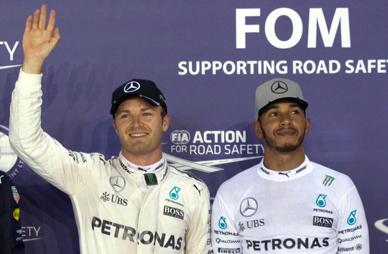 Mercedesu00e2u20acu2122 driver Nico Rosberg of Germany (left) celebrates pole position with Mercedesu00e2u20acu2122 driver Lewis Hamilton of Britain after qualifying at the Formula One Singapore Grand Prix in Marine Bay, Singapore, September 17, 2016. u00e2u20acu201d Reuters pic