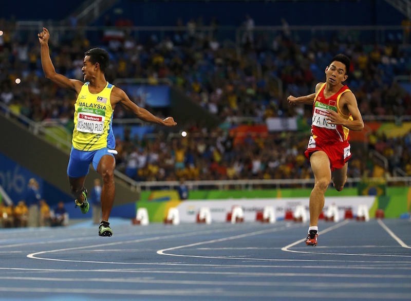 Mohamad Ridzuan Mohamad Puzi of Malaysia wins the gold medal in the event as Yang Yifei of China takes the silver in the menu00e2u20acu2122s 100m T36 final at the 2016 Rio Paralympics in Rio de Janeiro September 10, 2016. u00e2u20acu201d Reuters pic