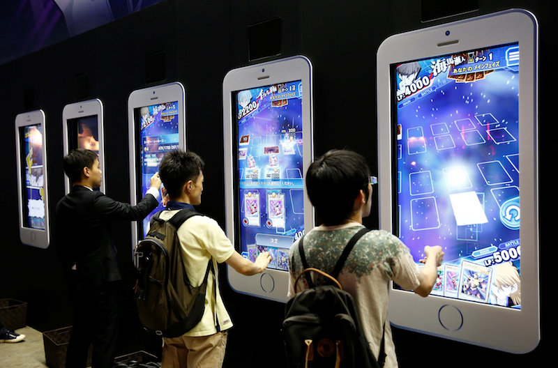 People play video games on mobile phone-shaped screens at Tokyo Game Show 2016 in Chiba, east of Tokyo, September 15, 2016. u00e2u20acu201d Reuters pic