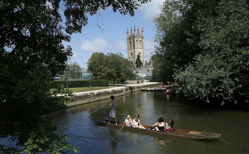 People punt on the river Cherwell past Magdalen College Tower in Oxford July 10, 2013. u00e2u20acu201d Reuters pic
