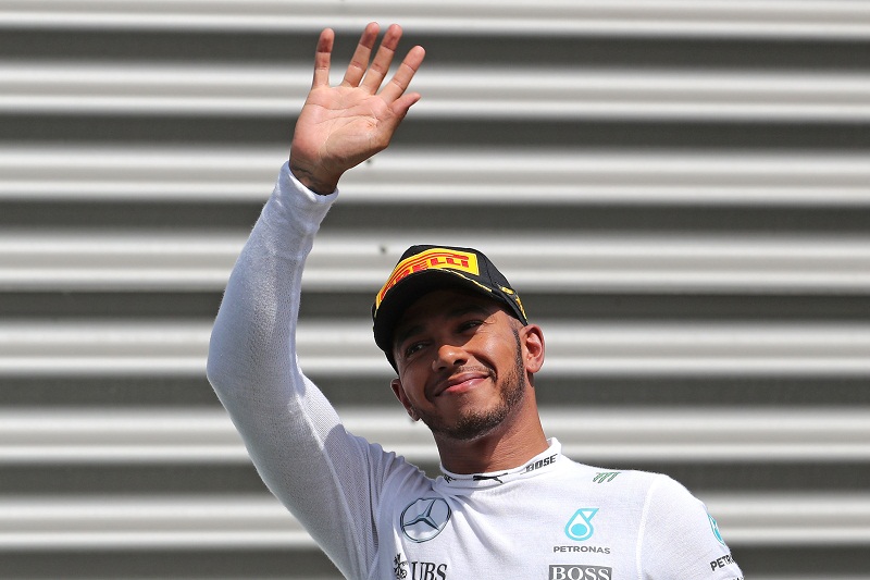 Mercedesu00e2u20acu2122 Lewis Hamilton of Britain waves on the podium after the Belgian F1 Grand Prix, in Francorchamps, Belgium August 28, 2016. u00e2u20acu201d Reuters pic