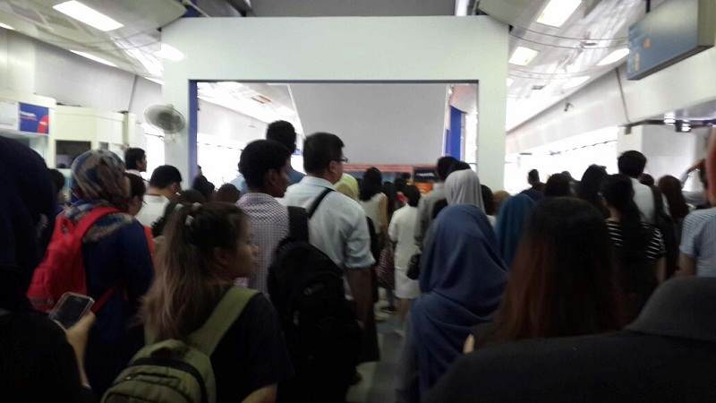 Commuters queue up outside the turnstiles at the Kelana Jaya LRT station. u00e2u20acu201d Picture by LRT user Hanis Maketab