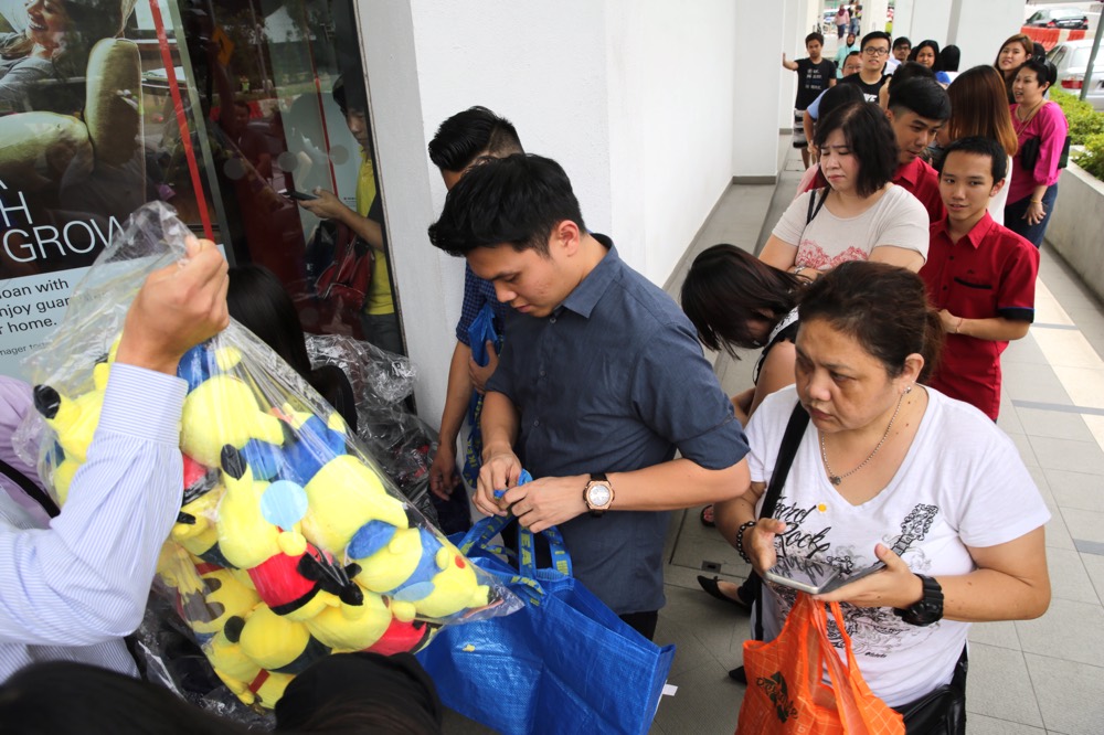 Customers queuing up for the fast-selling Pokemon plushies.