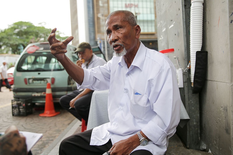 Mohd Yusof Mohd Diah, 65, says taxi drivers have invested too much in their taxis to make that change to Uber and Grab. u00e2u20acu201d Picture by Choo Choy May