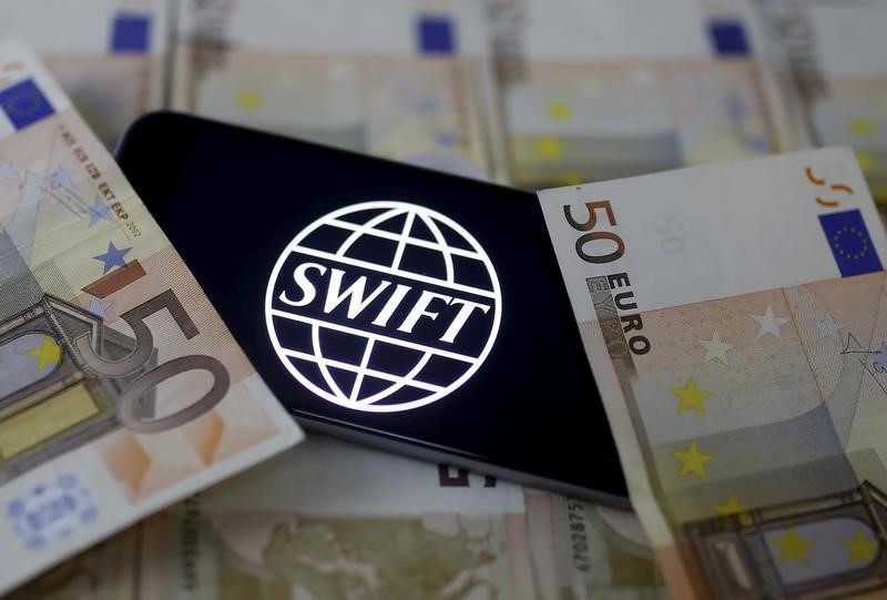 Swift code bank logo is displayed on an iPhone 6s on top of Euro banknotes in this picture illustration, January 26, 2016. u00e2u20acu201d Reuters pic