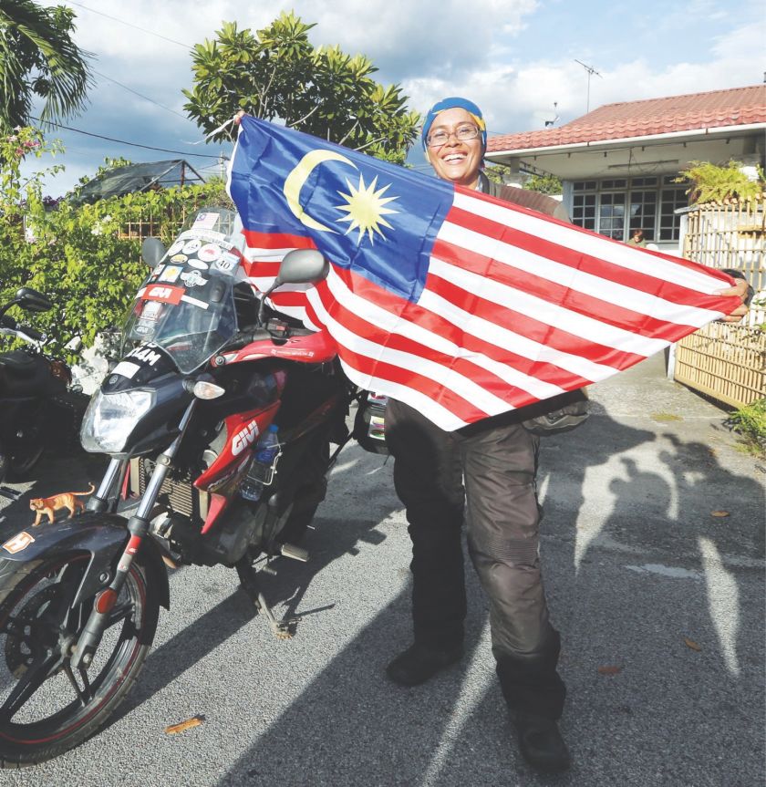 Anita strikes a pose in Ipoh after her solo expedition. u00e2u20acu201d Picture by Farhan Yusoff
