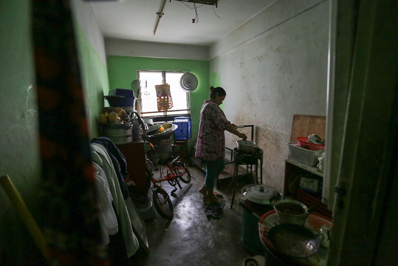 A woman cooks in her Kota Damansara PPR unit. — Picture by Choo Choy May