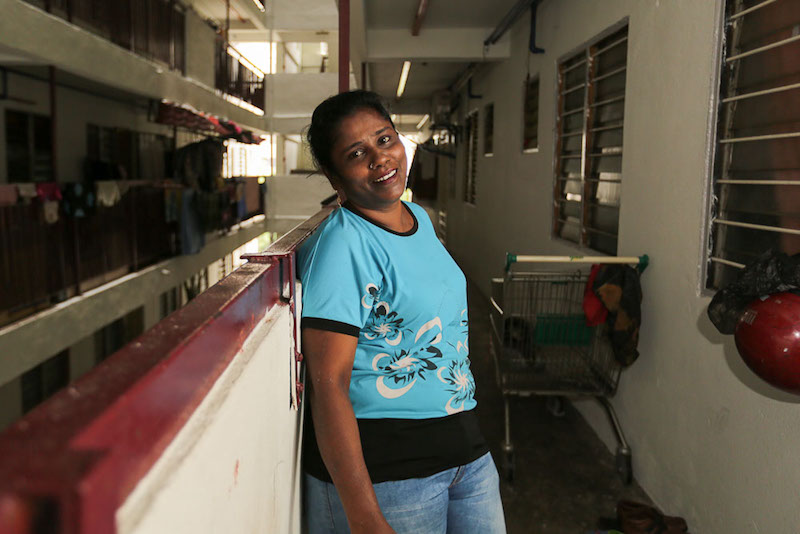 R. Malathi poses for a picture outside her Kota Damansara PPR unit. — Picture by Choo Choy May