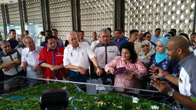 Prime Minister Datuk Seri Najib Razak looks at a scale model of Taman Tugu, the planned urban rainforest park in capital city Kuala Lumpur slated for completion in 2018. u00e2u20acu201d Picture by Ida Lim