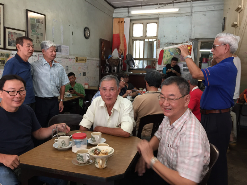 Regular customers having their last cup of coffee at Kong Thai Lai coffeeshop during its last day of business at Hutton Lane, George Town, September 26, 2016. — Picture by KE Ooi