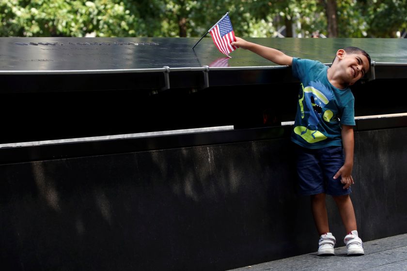 A boy poses in front of the memorial at the National September 11 Memorial and Museum in Lower Manhattan in New York City, US, September 9, 2016. u00e2u20acu201d Reuters pic 