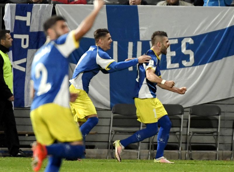 Valon Berisha of Kosovo (right) celebrates after scoring against Finland. u00e2u20acu2022 Reuters pic