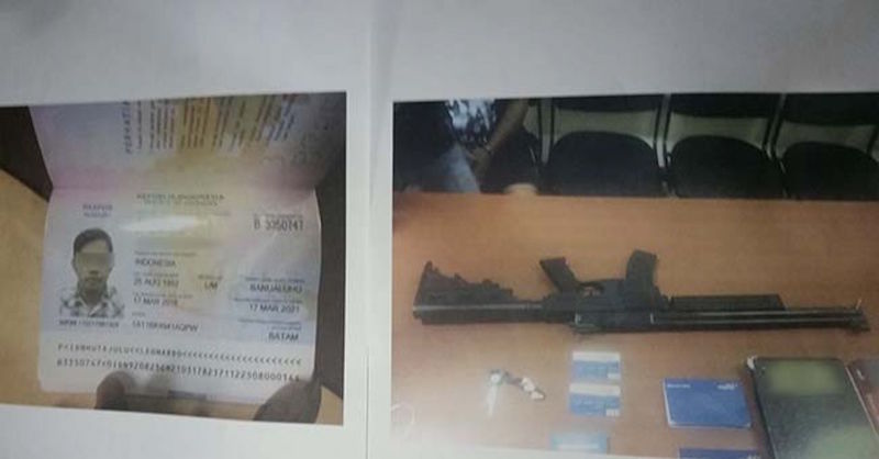 The passport of the suspect who was arrested, and items seized during last Saturdayu00e2u20acu2122s raid. u00e2u20acu201d Riau Police pic via TODAY