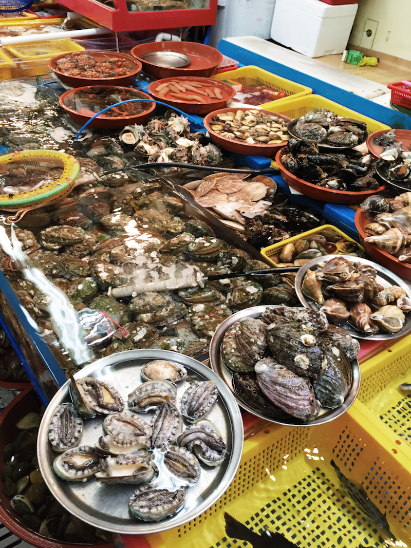 At Jagalchi Fish Market, customers can purchase live seafood from the many stalls and go to any of the eateries there to have them cooked for a nominal price. — Picture by Deborah Tan via TODAY