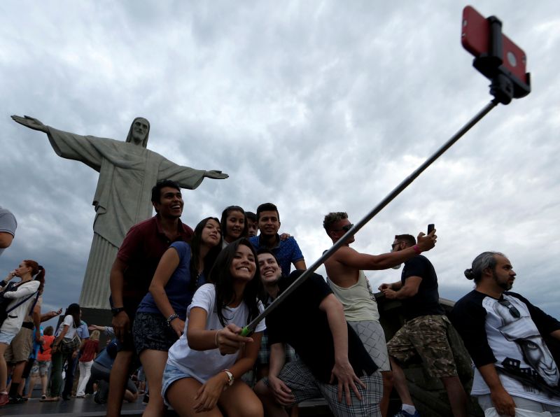 Tourists pose for a selfie at the Christ the Redeemer statue in Rio de Janeiro, Brazil September 8, 2016. u00e2u20acu2022 Reuters pic