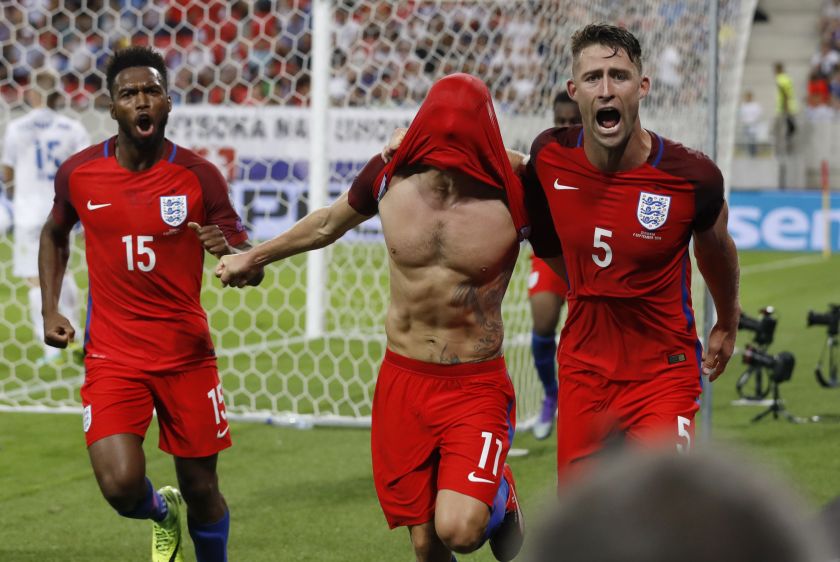 England's Adam Lallana (centre) celebrates scoring their first goal with team mates. u00e2u20acu201d Reuters pic