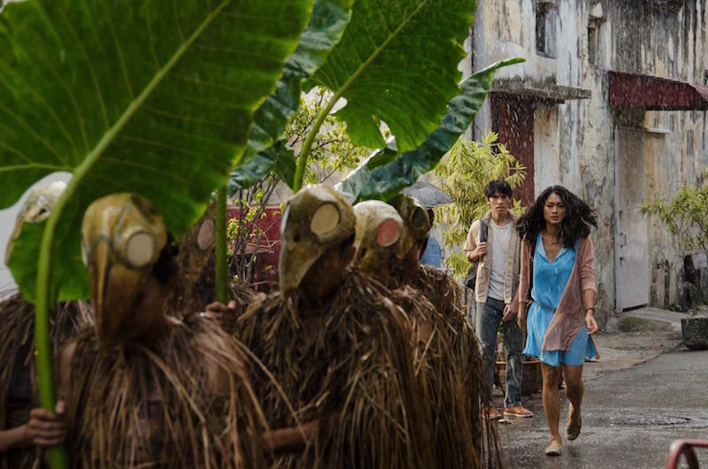 Adam (Iedil Putra) and Iva (Prisia Nasution) with shamans from Borneo in this scene from u00e2u20acu02dcInterchangeu00e2u20acu2122. u00e2u20acu201d Photo by Danny Lim (c) Apparat 2016 via TODAY