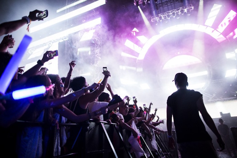 Japanese attend an electronic music concert during the Japan Ultra Music Festival at Odaiba Ultra Park in Tokyo September 18, 2016. u00e2u20acu201d AFP pic