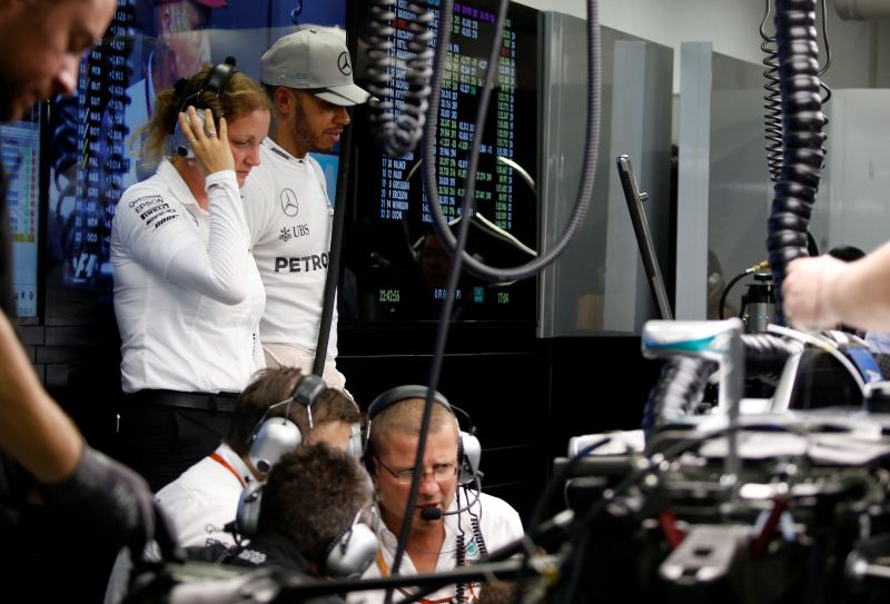 Mercedes' driver Lewis Hamilton of Britain looks at his car after the second practice session of the Singapore Grand Prix. u00e2u20acu2022 Reuters pic