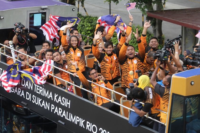 Malaysiau00e2u20acu2122s Paralympics athletes are pictured in an open-top bus parade as they make their way to KLCC on September 22, 2016. u00e2u20acu2022 Picture by Choo Choy May
