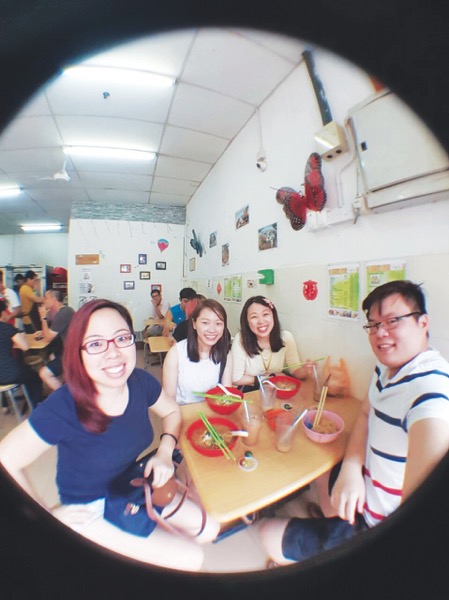 Huixin (left) and her Sarawakian friends Siow Lee Fong, Shirly Wong and Sylvester Tiong enjoy Sarawak laksa at a shop in Kelana Jaya. u00e2u20acu201d Malay Mail pic