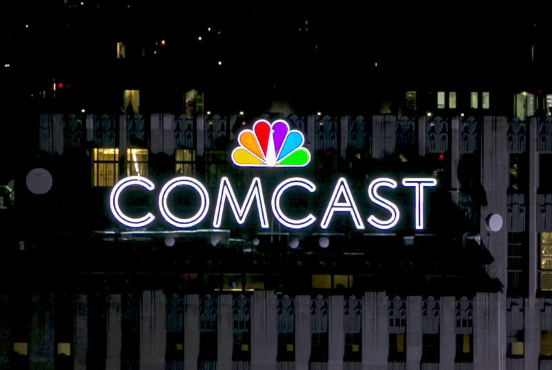 The NBC and Comcast logo are displayed on top of 30 Rockefeller Plaza, formerly known as the GE building, in New York July 1, 2015. REUTERS/Brendan McDermid/File Photo