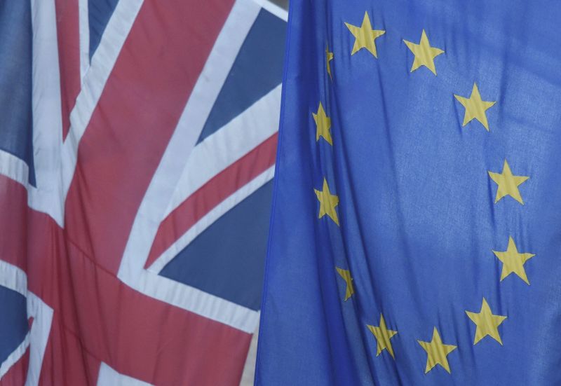 A Union flag flies next to the flag of the European Union in Westminster, London, June 24, 2016. REUTERS/Toby Melville/File Photo