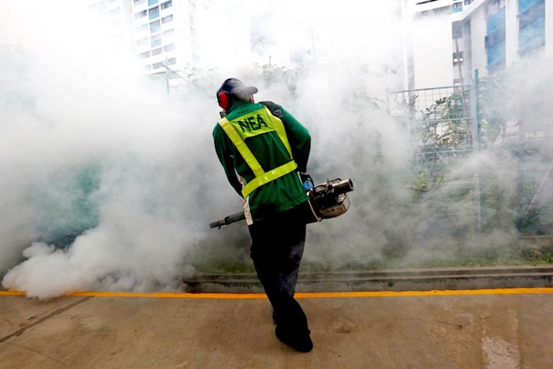 A NEA worker conducts thermal fogging during a demonstration at the Paya Lebar Way area on vector control operations and inspection of premises to check for mosquito breeding at the Paya Lebar Way area on September 1, 2016. u00e2u20acu201d TODAY pic