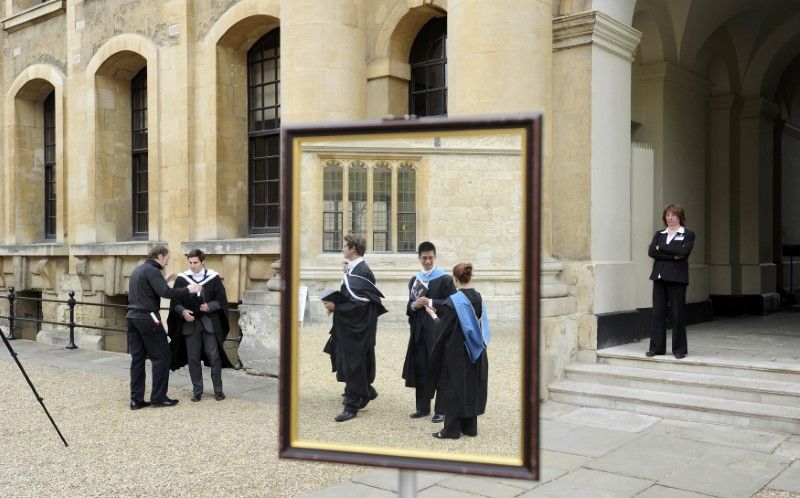 Graduates queue to have their photograph taken after a graduation ceremony at Oxford University, Oxford, southern England in this May 28, 2011. u00e2u20acu201d Picture by Reuters