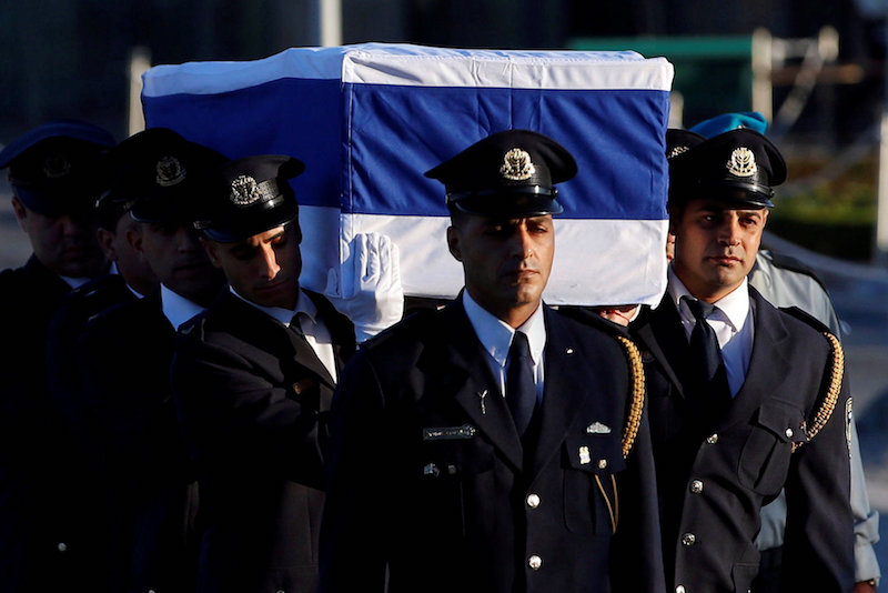 The flag-draped coffin of former Israeli President Shimon Peres is carried by members of a Knesset guard upon its arrival at the Knesset Plaza, is Jerusalem September 29, 2016. u00e2u20acu201d Reuters pic 