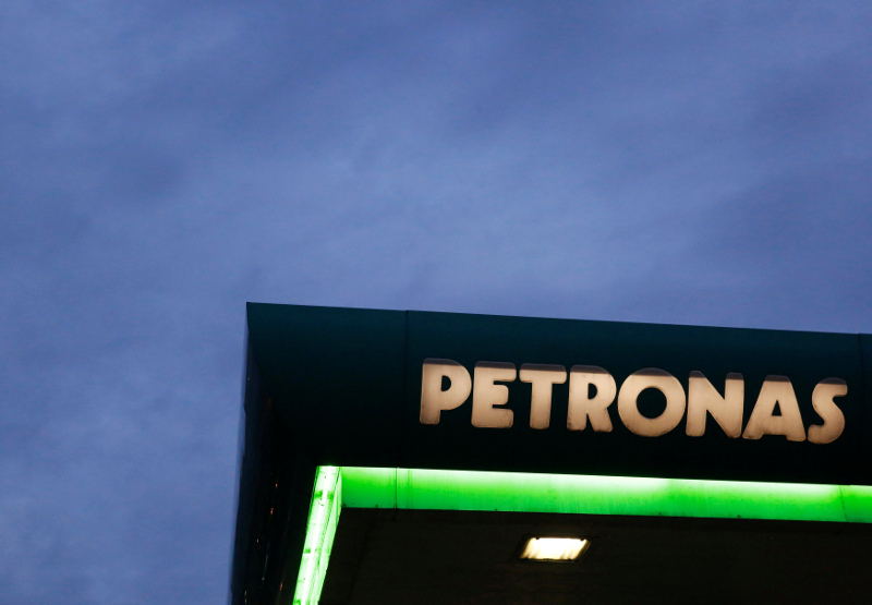A logo of a Petronas fuel station is seen against a darkening sky in Kuala Lumpur, Malaysia February 10, 2016. u00e2u20acu201d Reuters pic