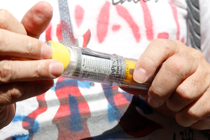 Lunceford Stevens holds an EpiPen during a protest outside the offices of hedge fund manager John Paulson over his fund’s investment in Mylan, which manufactures EpiPens, in New York City, US, August 30, 2016.