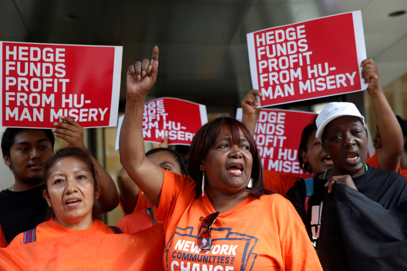 People protest outside the offices of hedge fund manager John Paulson over his fundu00e2u20acu2122s investment in Mylan, which manufactures EpiPens, in New York City, US, August 30, 2016. u00e2u20acu201d Reuters pic