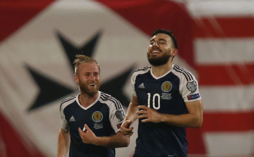 Scotland's Robert Snodgrass celebrates scoring their fifth goal with Barry Bannan (left). u00e2u20acu201d Reuters pic