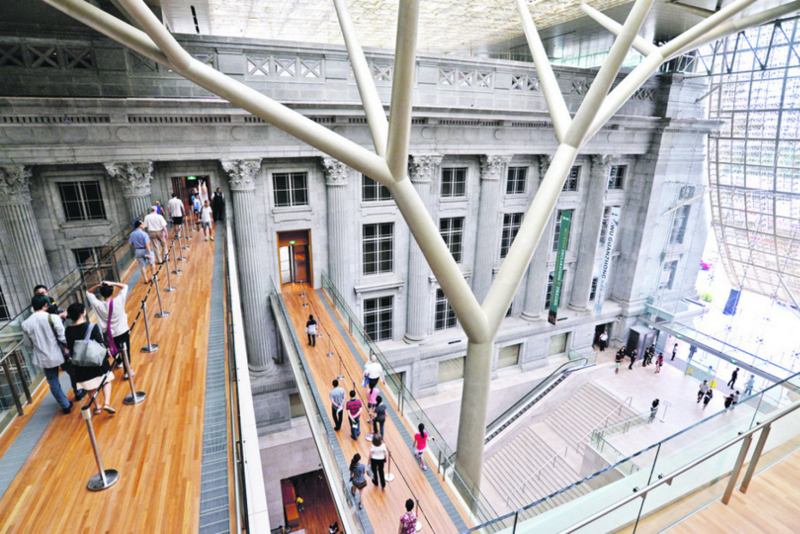 Visitors crossing the link bridges at connecting the former Supreme Court and Cityhall sections at the National Gallery Singapore. u00e2u20acu201d Picture by Robin Choo/TODAY