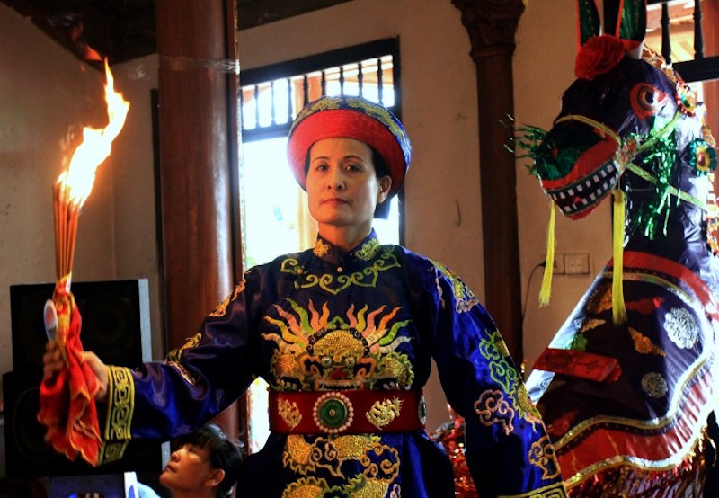 Professional shaman La Thi Tam performs a u00e2u20acu02dcLen Dongu00e2u20acu2122 dance at a temple in Hanoi August 13, 2016. u00e2u20acu201d AFP pic
