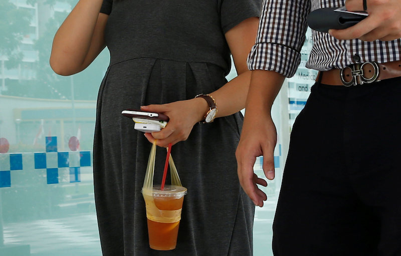 A pregnant couple walk together at a potential zika cluster in Singapore September 1, 2016. u00e2u20acu201d Reuters pic 