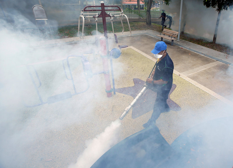 A worker fogs a community playground at a new Zika cluster area in Singapore September 1, 2016. u00e2u20acu201d Reuters pic