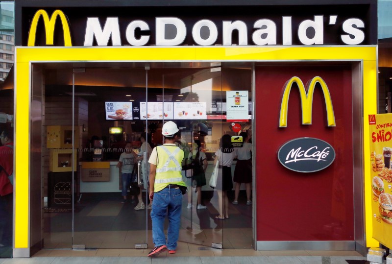 A man enters a McDonald's restaurant in Singapore July 25, 2016. Picture taken July 25, 2016. REUTERS/Edgar Sun