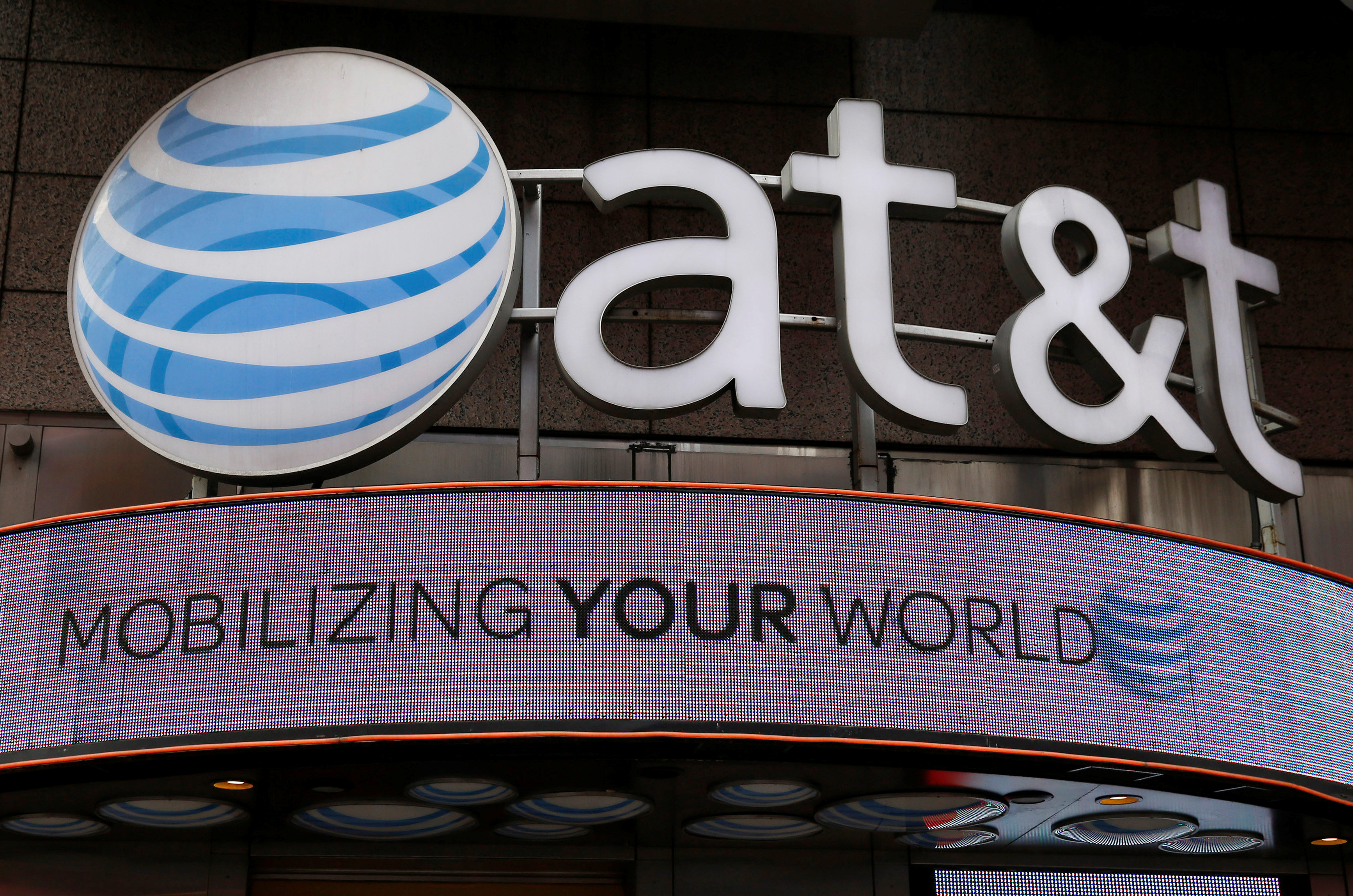 Signage for an AT&T store is seen in New York October 29, 2014. REUTERS/Shannon Stapleton/File Photon